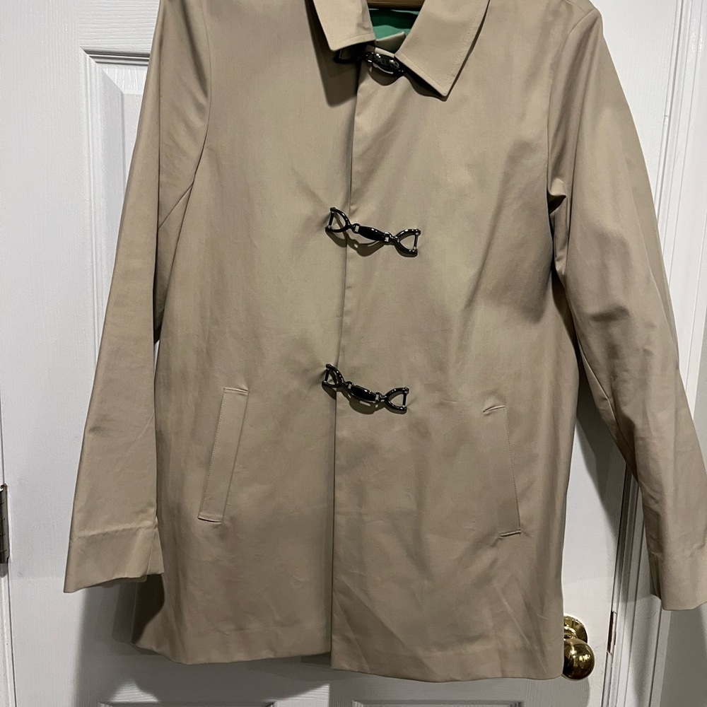 Woman’s Classic Tan Trench Coat with Toggle Closures